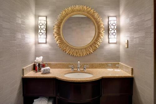 a bathroom with a sink and a mirror at Charleston Marriott in Charleston