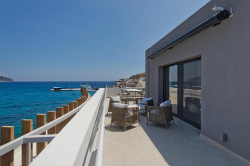 a balcony with a view of the water at Arcus Luxury Suites Karpathos in Karpathos Town