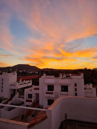 a sunset view from the roof of a building at Coco Surfhouse - Coworking Coliving in Corralejo