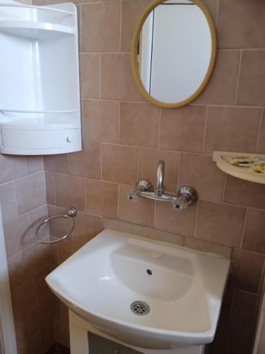 a bathroom with a sink and a mirror at Къща за гости Ганчеви in Sozopol