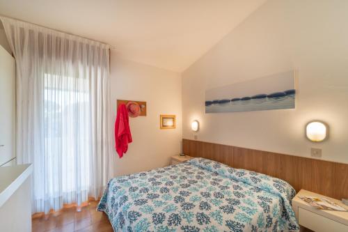 En eller flere senge i et værelse på Villaggio Club dei Pini
