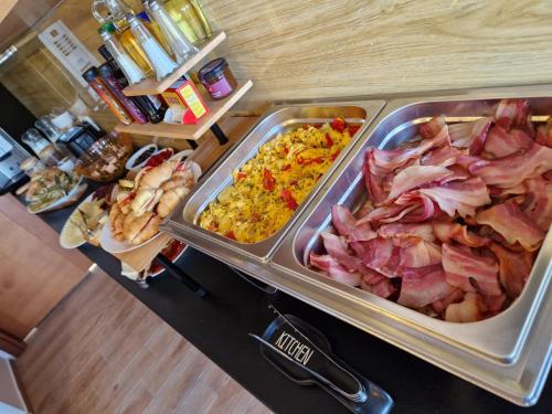 a counter top with a bunch of food on it at Apartmani Marina Kopitovic in Petrovac na Moru