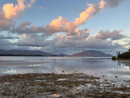 a view of a body of water with a cloudy sky at chez Gérald in Noumea