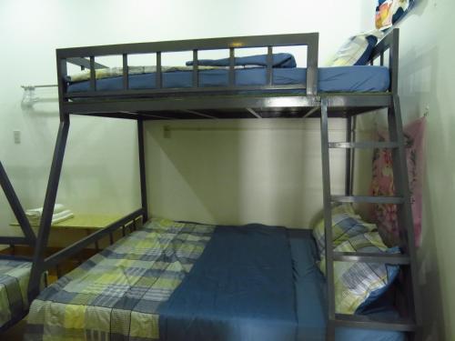a couple of bunk beds in a room at HO GIA AN Home - Căn hộ yên bình in Can Tho