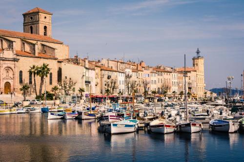 a bunch of boats are docked in a harbor at Coup de coeur in Ceyreste