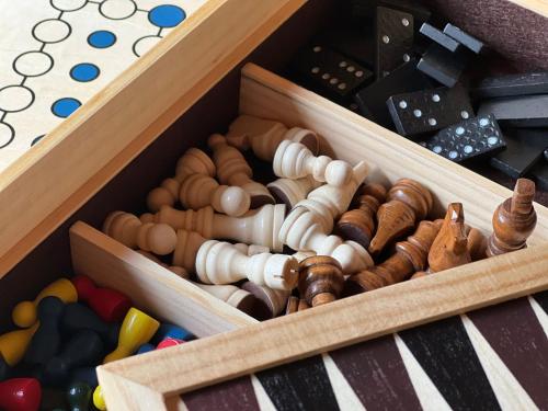 a wooden box filled with different types of toys at Kleines Chalet im Erzgebirge mit Sauna und Kamin in Rechenberg-Bienenmühle