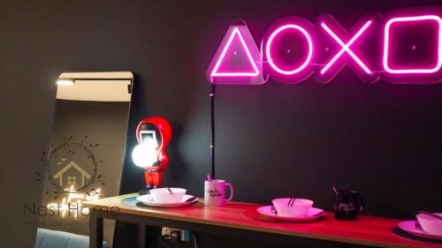 a room with a table with a neon sign at Twin Tower Residence by Nest Home【5 mins walk to CIQ】 in Johor Bahru