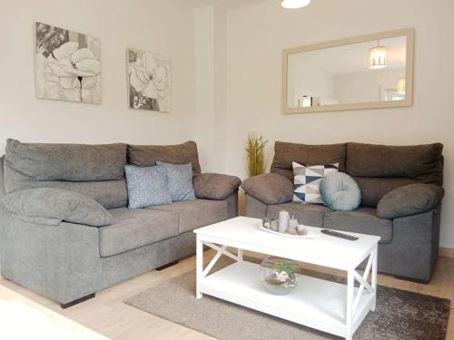 a living room with a couch and a table at La Casa de Marina in Vivero