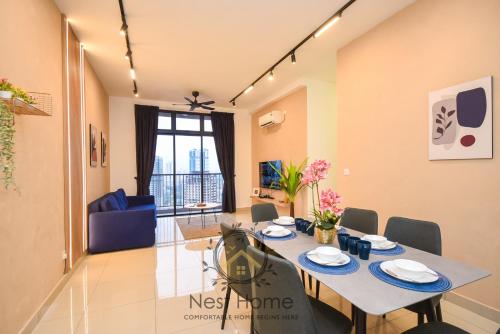 a dining room and living room with a table and chairs at Twin Tower Residence by Nest Home【5 mins walk to CIQ】 in Johor Bahru