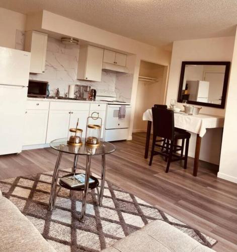a living room with a table and a kitchen at North Star Place Apt 12 (premium) in Fairbanks
