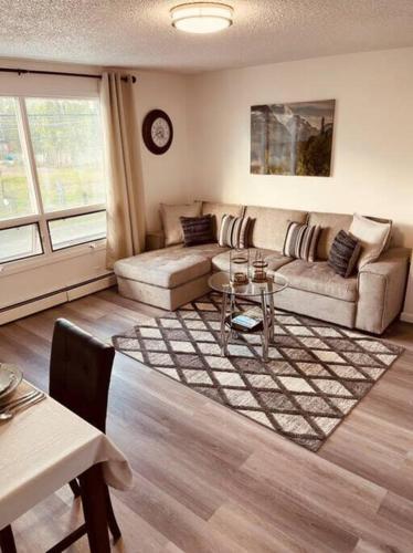 a living room with a couch and a table at North Star Place Apt 12 (premium) in Fairbanks