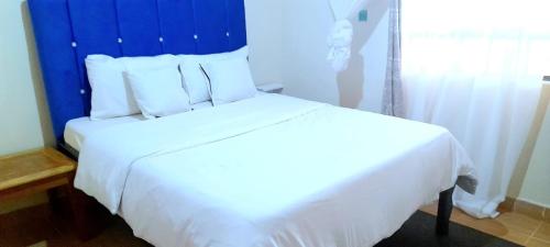 Cama o camas de una habitación en Maridadi place