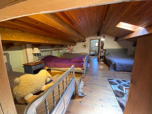 a living room with two beds and a couch at La paresse in Avèze