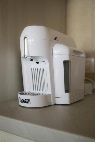 a white mixer sitting on top of a counter at Agriturismo Cascina della Fontana in Lodi