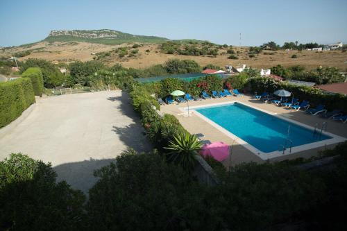 an aerial view of a swimming pool with a resort at Apartamentos Bolonia Paraiso in Bolonia