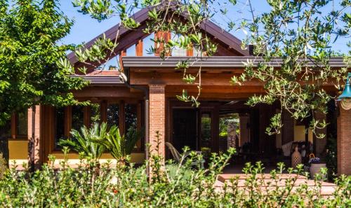 a brick house with trees in front of it at B&B Villa Sbaraglia in Alatri