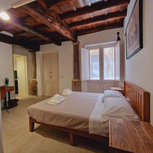 Ліжко або ліжка в номері Casina Giubbonari