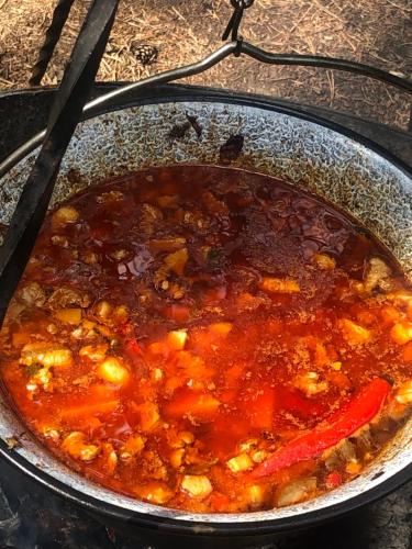a pot of stew on top of a stove at Leśnik Bungalow Stegna - domki letniskowe nad morzem in Stegna