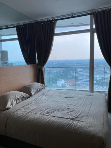 RoomQu at Apartment Amazana Serpong Residence