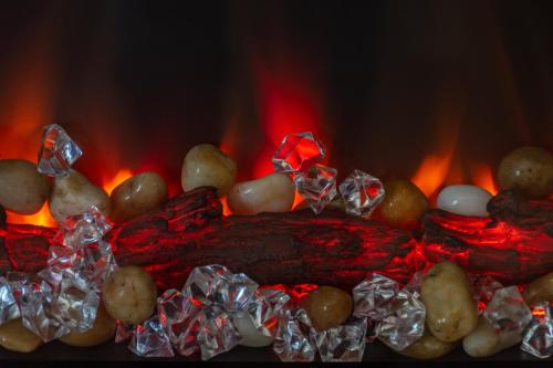 a close up of a fire with potatoes anduminum foil at ARIA DELUXE Mobile Homes with Terme Čatež Tickets in Čatež ob Savi