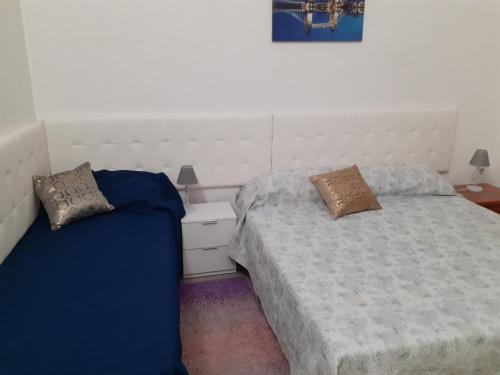 Postel nebo postele na pokoji v ubytování casa mare