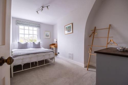 a bedroom with a bed and a window at Beautiful & Spacious Retreat in Winchester in Winchester