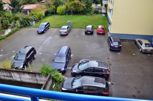 a group of cars parked in a parking lot at Hotel Garni Oberrhein in Rheinfelden