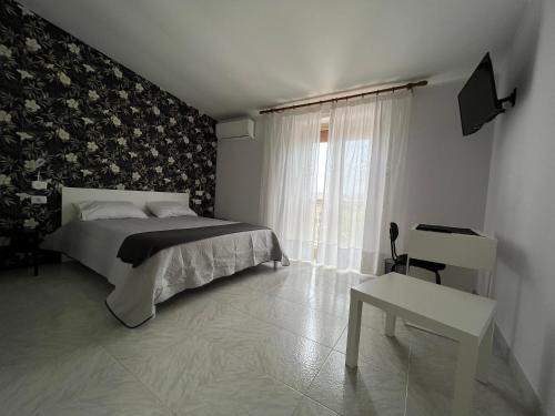 Ένα ή περισσότερα κρεβάτια σε δωμάτιο στο B&B Il Borgo