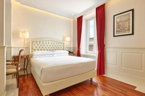 Letto o letti in una camera di Hotel Degli Artisti