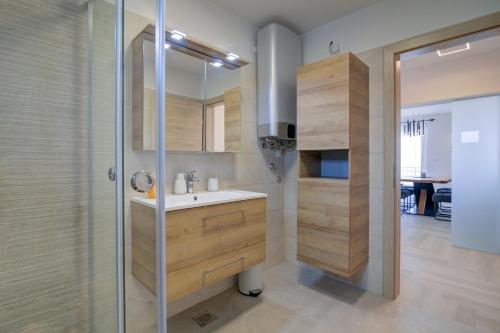 a bathroom with a sink and a shower at FRANKO in Senj