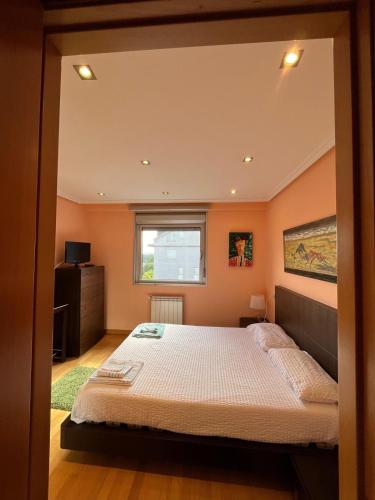 a bedroom with a bed and a window at Salinas al Mar in Salinas