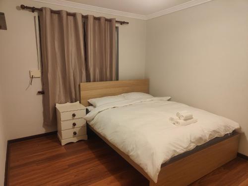 Ένα ή περισσότερα κρεβάτια σε δωμάτιο στο The Cozy little House