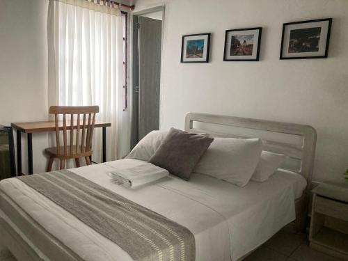 Postel nebo postele na pokoji v ubytování Hotel Casa de las Dos Palmas -Hotel Boutique
