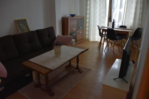 a living room with a couch and a table at Apartment Monika in Široki Brijeg