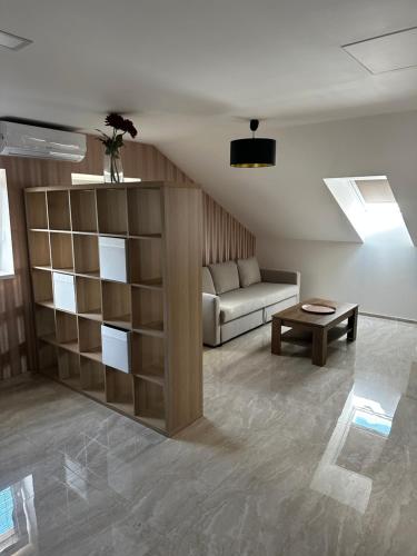 a living room with a couch and a table at Apartmany u Polanských Lednice in Lednice