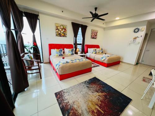 a bedroom with two beds and a ceiling fan at Studio I-Soho D'Gunduls Homestay by DGH I-CITY in Shah Alam