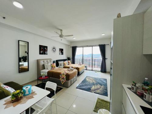 a living room with a bed and a couch at Studio I-Soho D'Gunduls Homestay by DGH I-CITY in Shah Alam