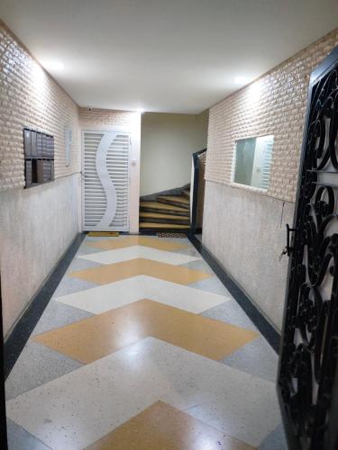 a hallway with ailed floor in a building at PERLE Au centre de RABAT in Rabat