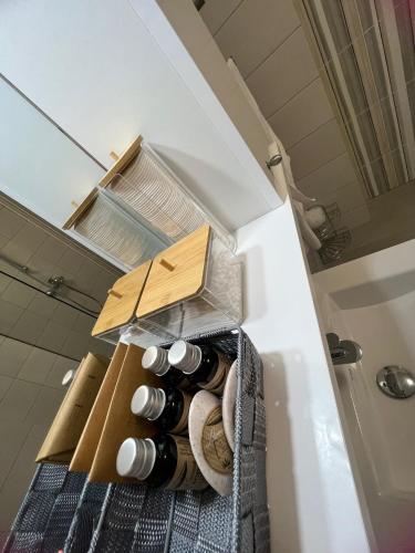 a refrigerator filled with lots of wine bottles at Apartament Hera Mamaia Nord in Năvodari