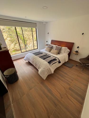 מיטה או מיטות בחדר ב-Apartamento tuterra El Recuerdo