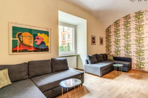 a living room with a couch and a table at DOWNTOWN SRL - Croce di Malta Royale in La Spezia
