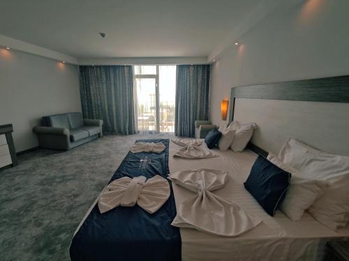 Ένα ή περισσότερα κρεβάτια σε δωμάτιο στο Moonlight Hotel - All Inclusive