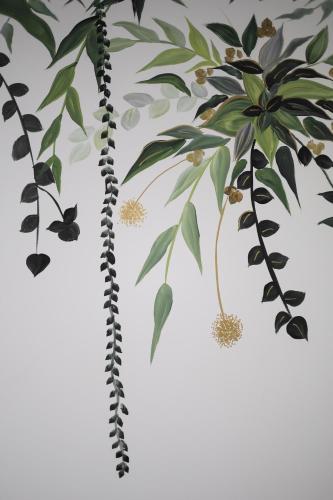 a tree with leaves and butterflies on a wall at Sabbia Mini Pool Suites in Preveza