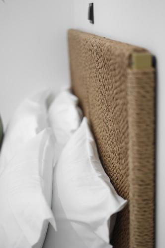 a close up of a pillow on a bed at Sabbia Mini Pool Suites in Preveza
