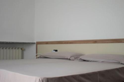 En eller flere senge i et værelse på Appartamento Dante