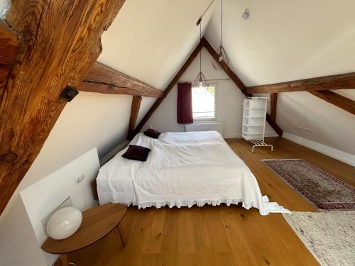 a bedroom with a bed in a attic at Ferienhaus Maria in Walsdorf