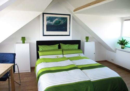 מיטה או מיטות בחדר ב-Duinen Paradijs Zandvoort