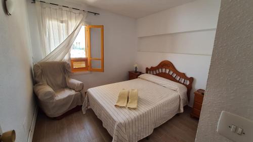 מיטה או מיטות בחדר ב-APARTAMENTO CON PISCINA EN MOJACAR PLAYA
