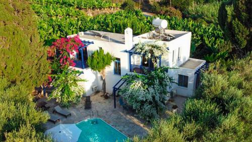 an aerial view of a white house with a swimming pool at Banana Sunset Villas in Paphos