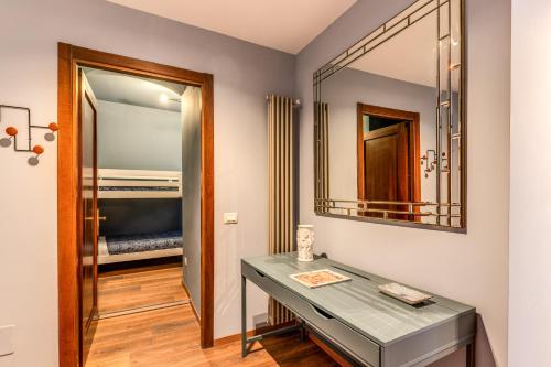 a bathroom with a glass table and a mirror at Cinque Terre Dream in La Spezia